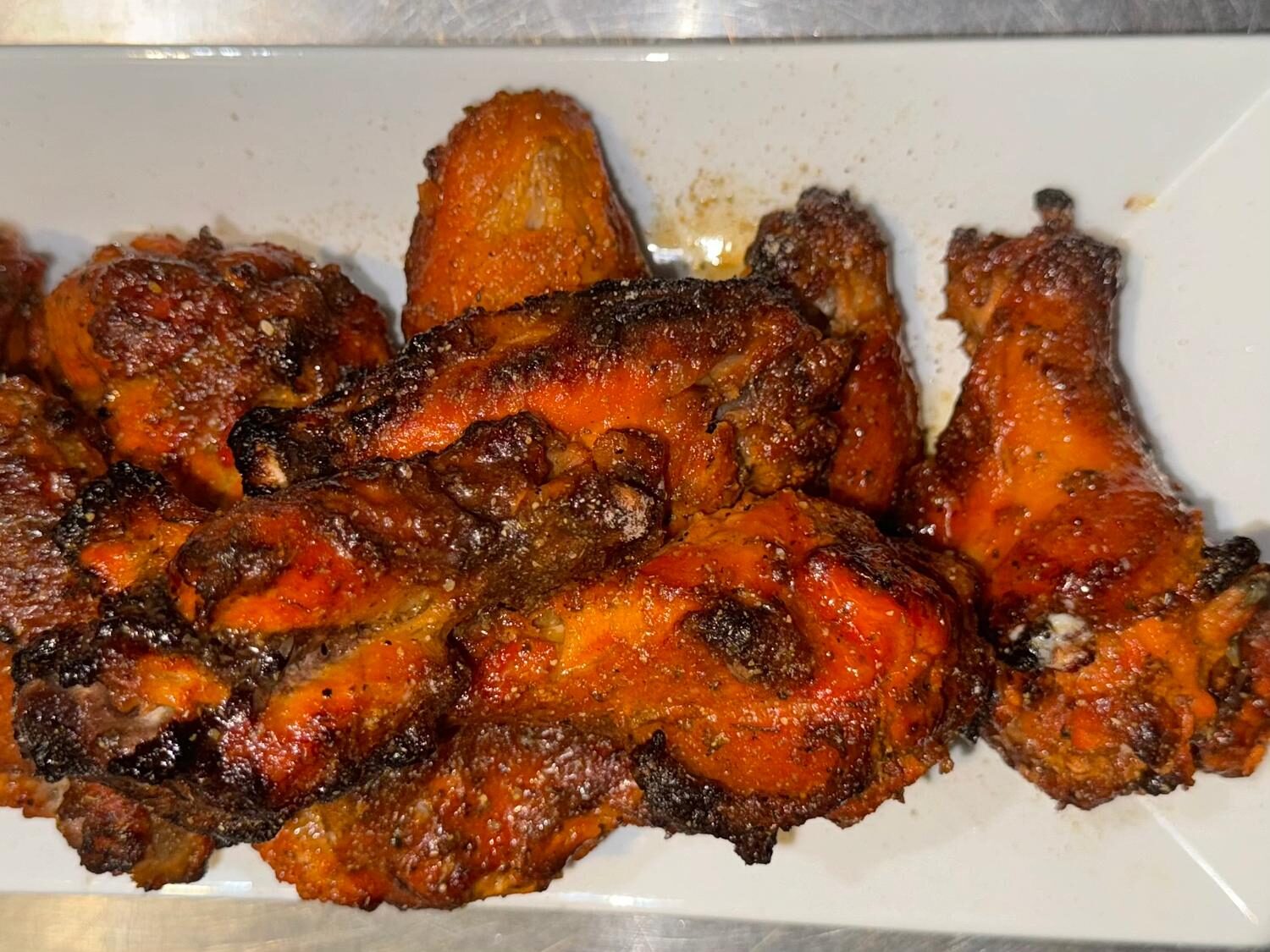 Tandoori chicken wings platter with charred masala crust