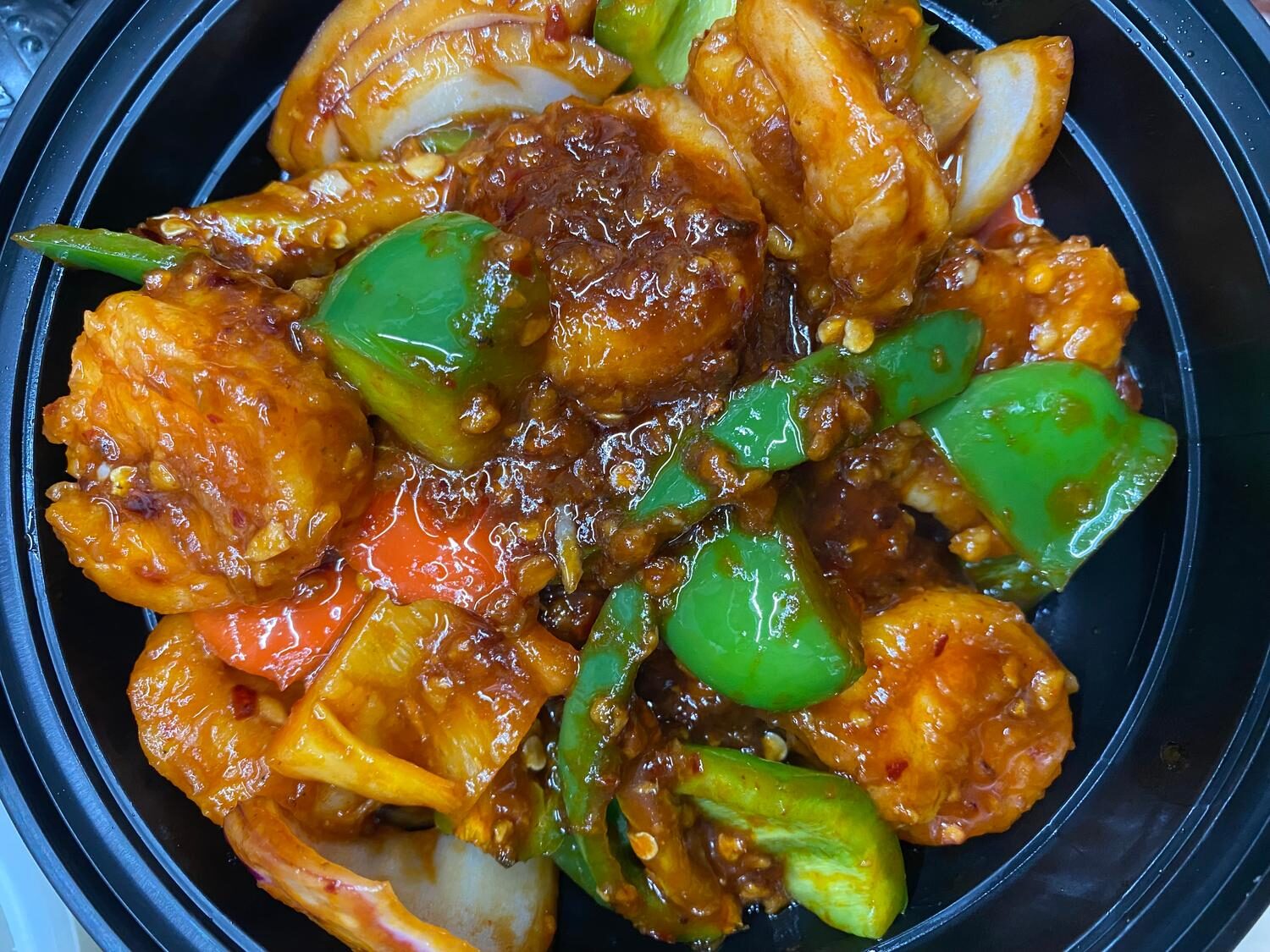 Indo-Chinese chilli shrimp tossed with bell peppers and onions in spicy garlic sauce