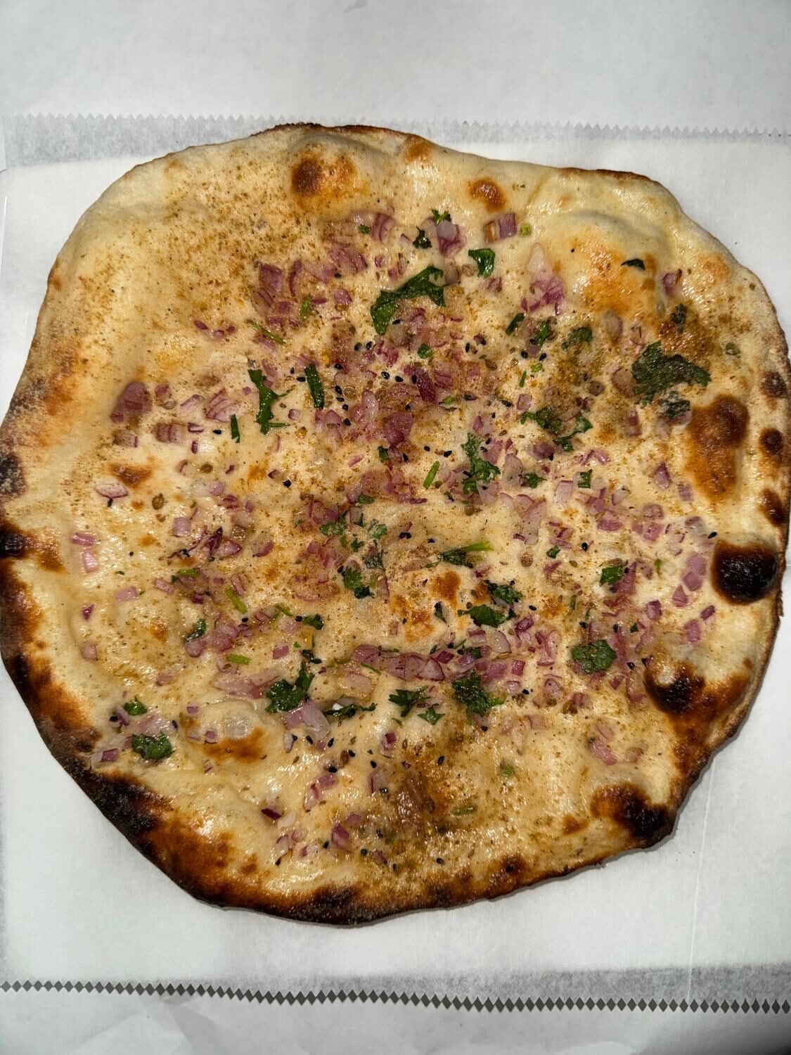 Onion kulcha with red onions, cilantro and toasted nigella seeds