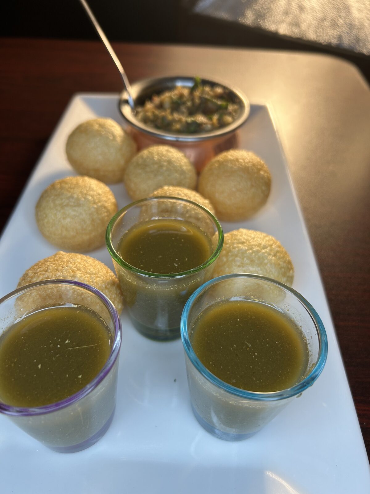 Pani puri with mint water and spiced potato filling