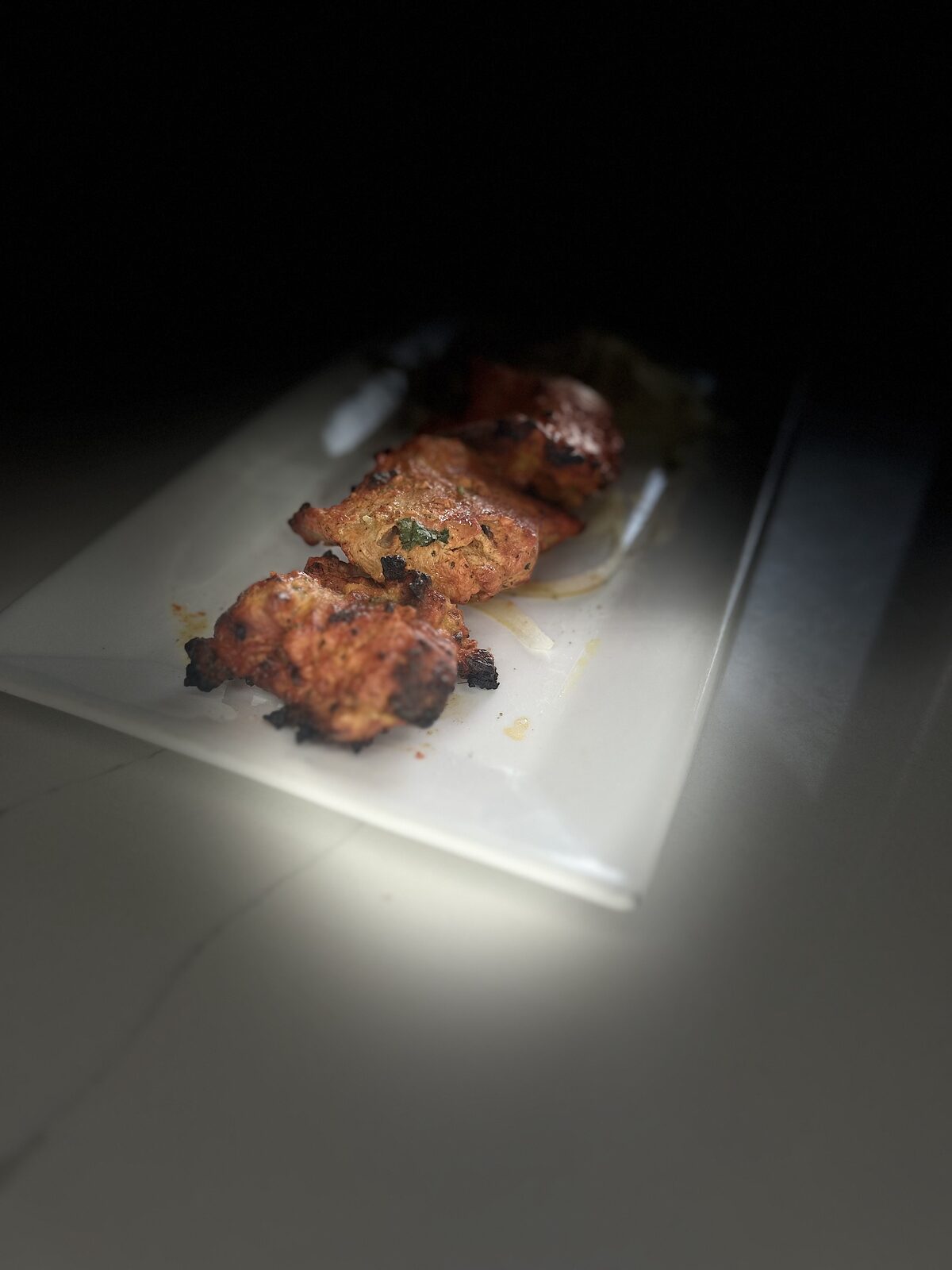 Seekh kabab — spiced ground meat skewers grilled in the tandoor