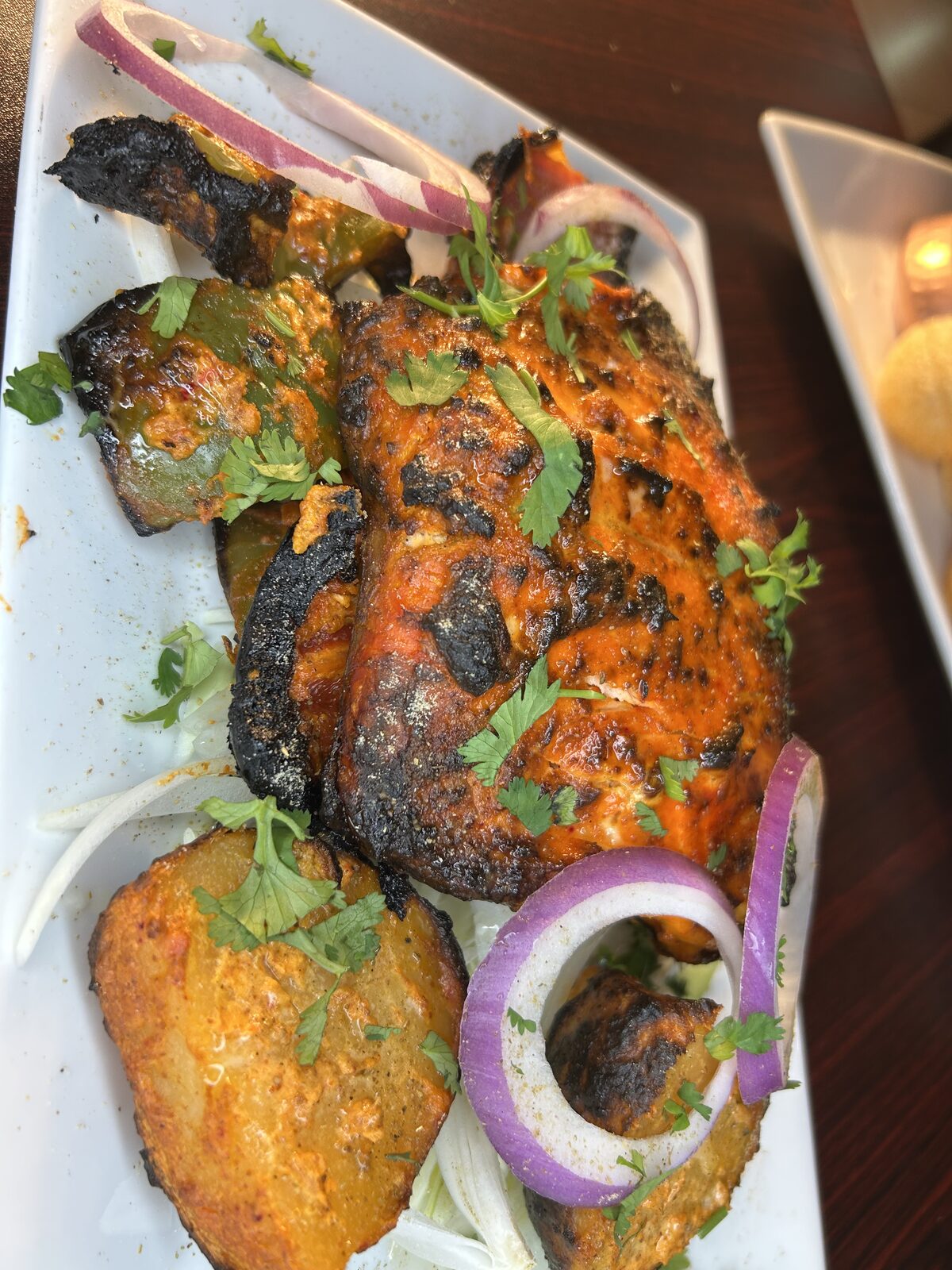 Tandoori chicken with charred peppers and onions from the clay oven